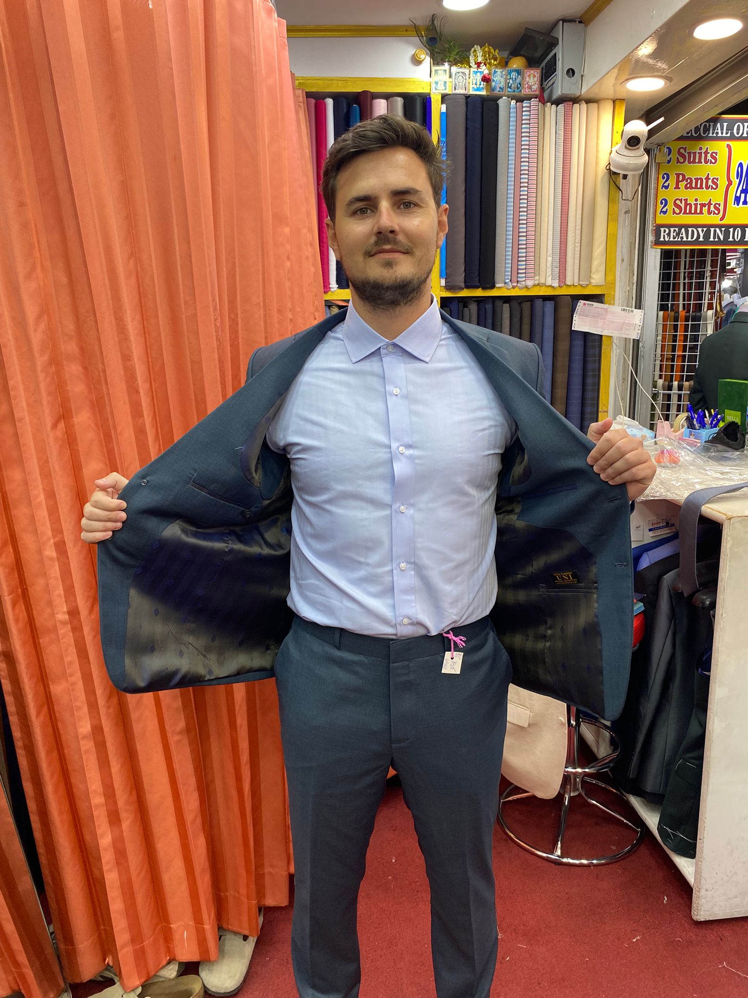 Happy client in custom tailored suit at King Fashion Uni Bangkok
